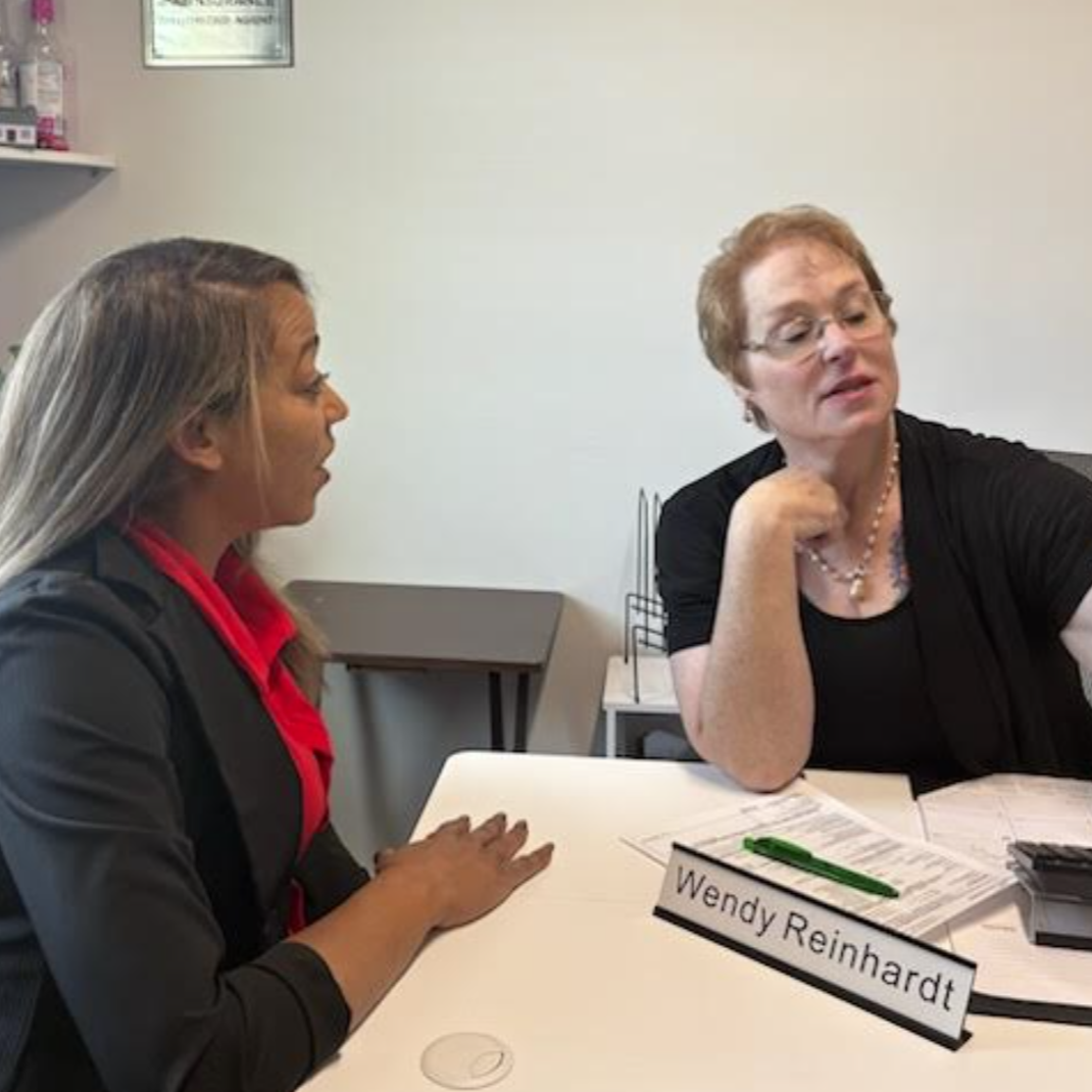 wendy talking to team member in her office